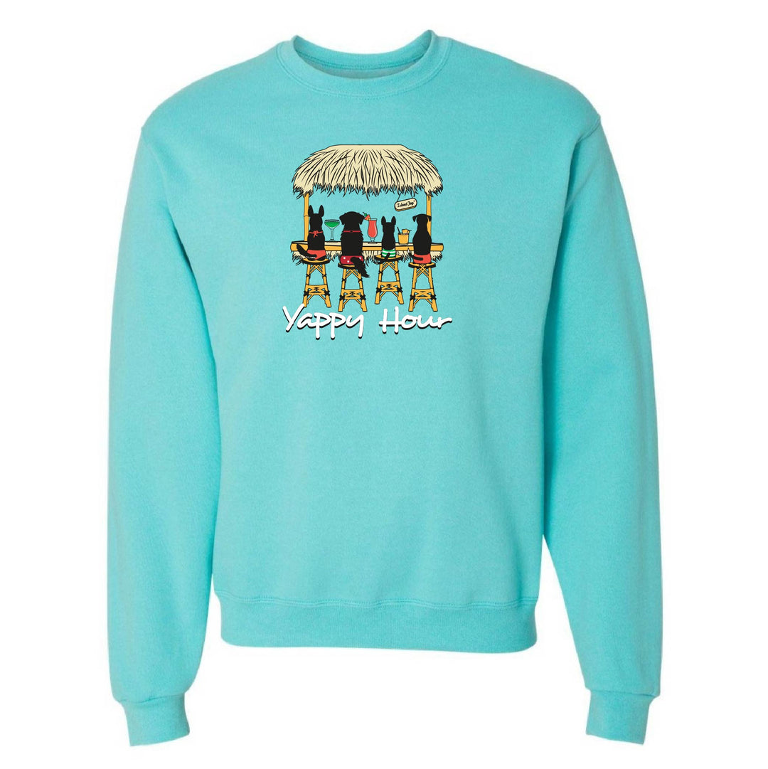 Turquoise sweatshirt with a graphic of dogs around a table under a thatched roof and 'Yappy Hour' text.