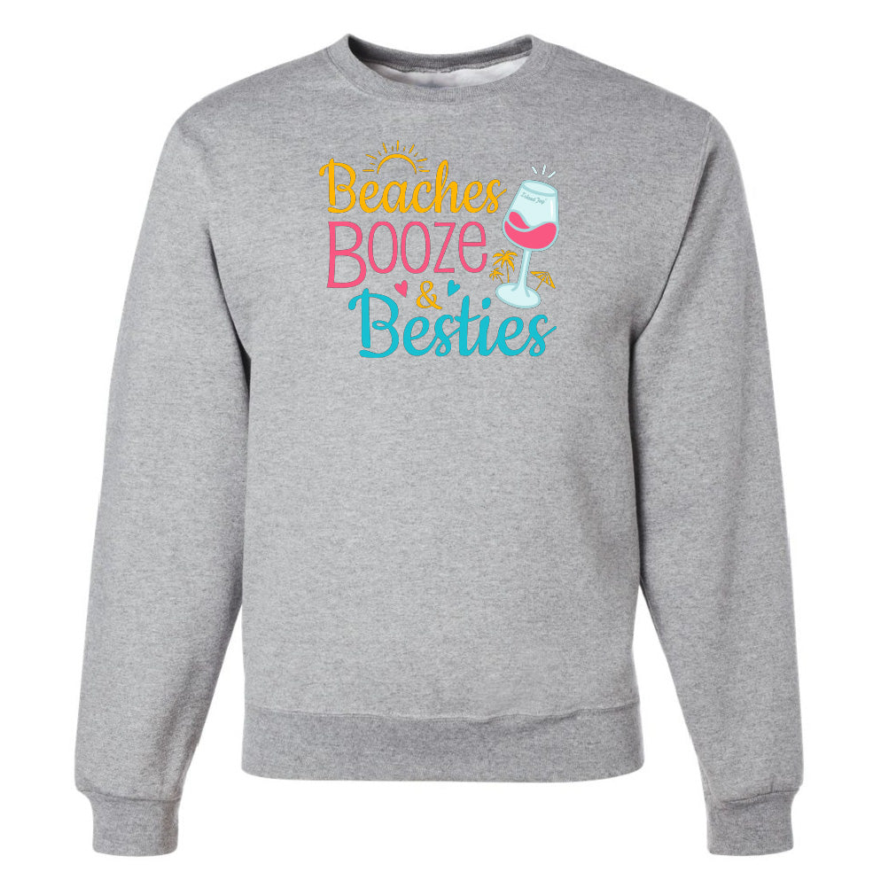 Gray sweatshirt with 'Beaches Booze & Besties' text and wine glass graphic on a white background