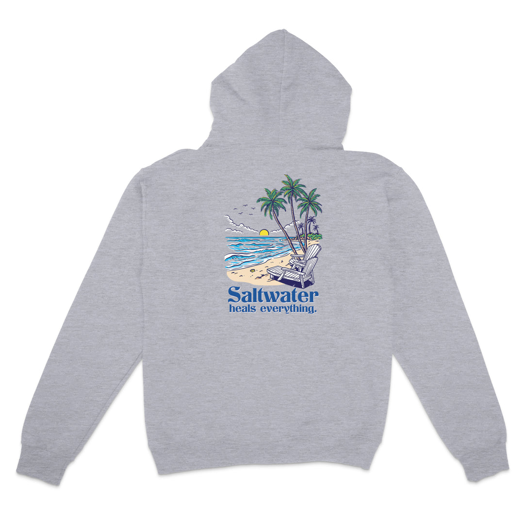 Gray hoodie with a beach graphic and 'Saltwater heals everything' text on the back, on a white background.