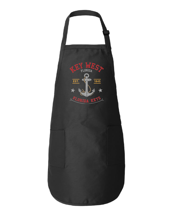 Black apron with 'Key West, Florida Keys' design featuring an anchor on a white background.
