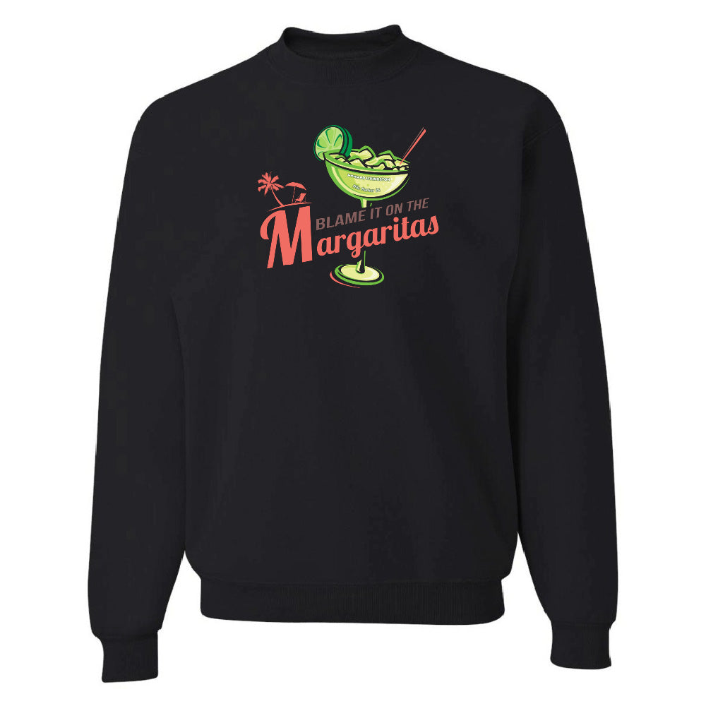 Black sweatshirt with a graphic of a margarita and text 'Blame it on the Margaritas' on a white background