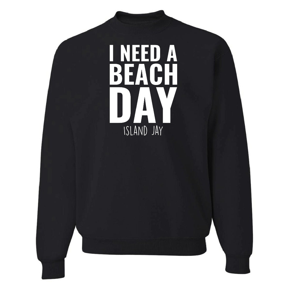 Black sweatshirt with 'I NEED A BEACH DAY' text on a white background