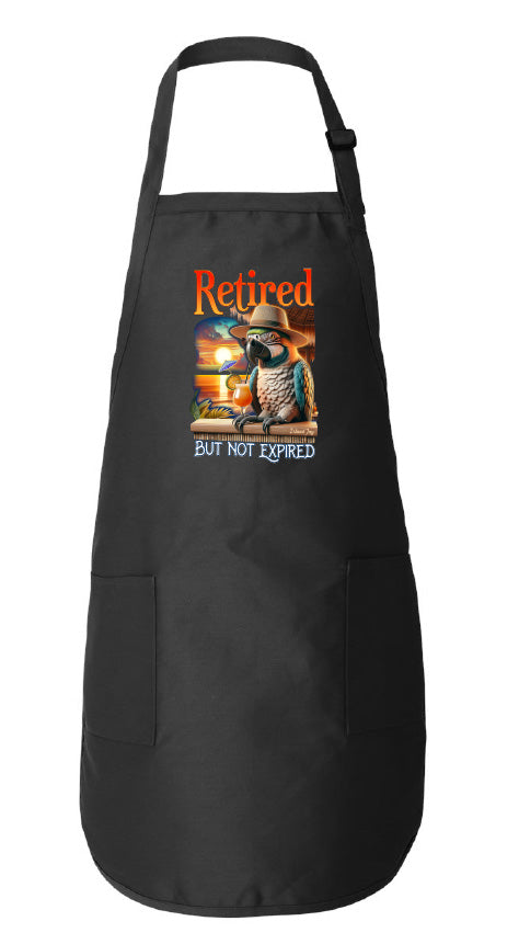 Black apron with a colorful graphic and text 'Retired but not expired' on a white background