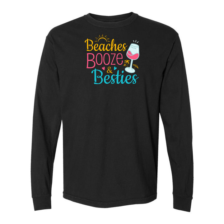 Black long-sleeve shirt with 'Beaches Booze & Besties' text and wine glass graphic on a white background