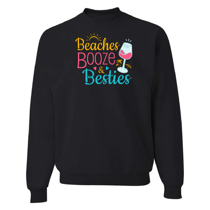 Black sweatshirt with colorful text 'Beaches Booze & Besties' on a white background