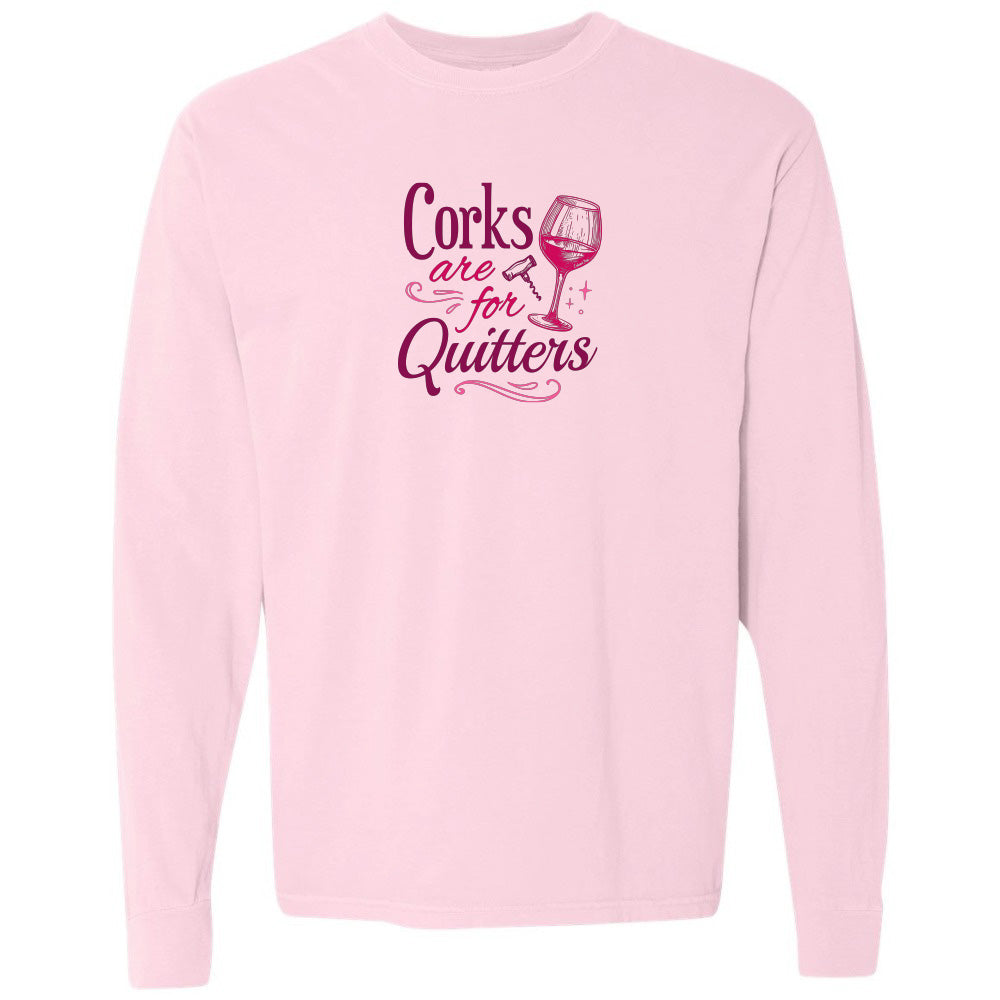Pink sweatshirt with 'Corks are for Quitters' text and wine glass graphic on a white background