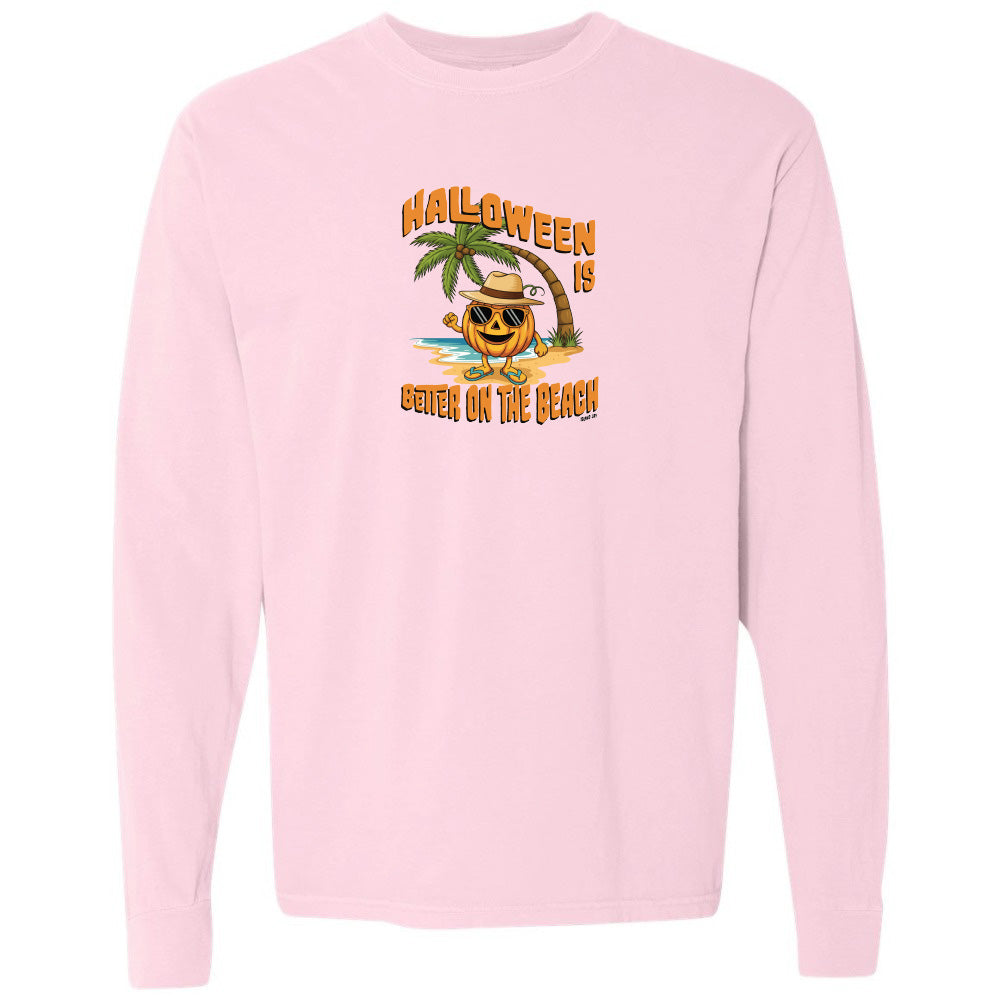 Pink sweatshirt with Halloween design featuring a pumpkin on a beach.