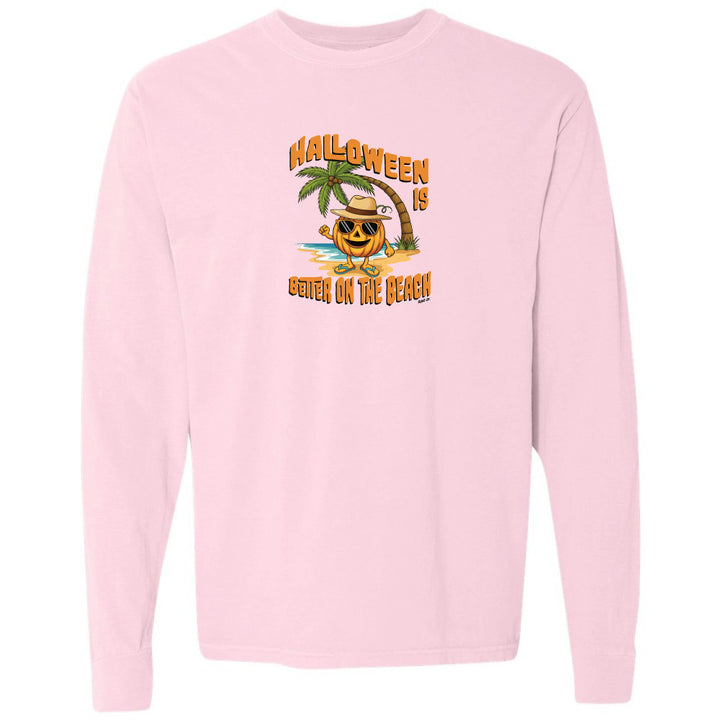Pink sweatshirt with Halloween design featuring a pumpkin on a beach.