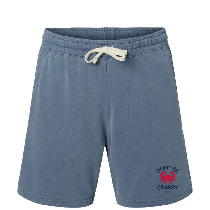 Blue shorts with a crab graphic and text on a white background