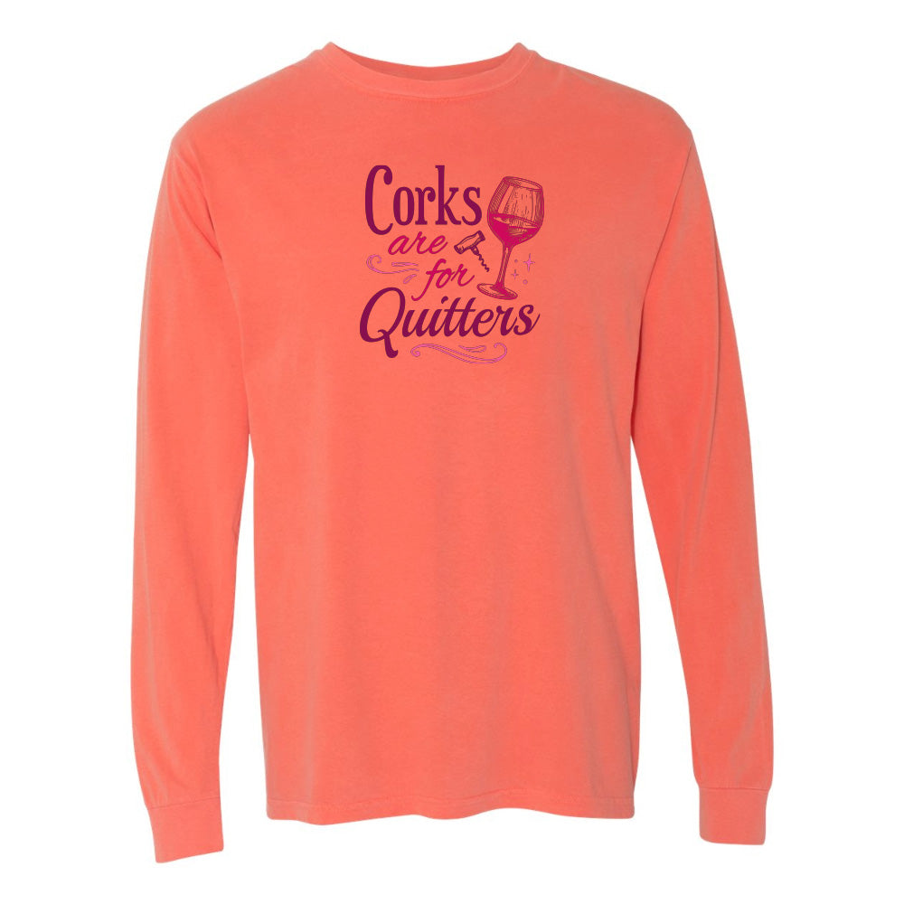 Coral long-sleeve shirt with purple text and wine glass graphic on a white background