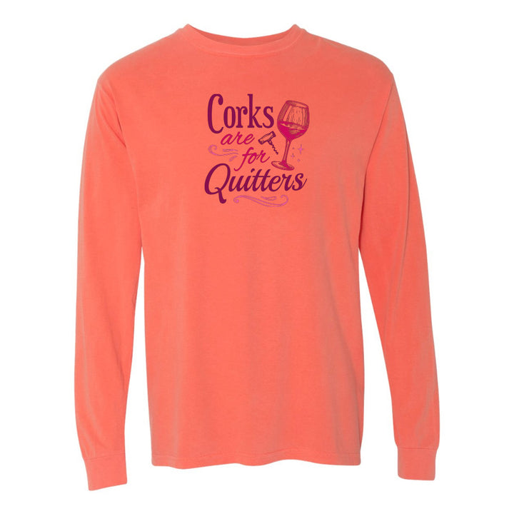 Coral long-sleeve shirt with purple text and wine glass graphic on a white background