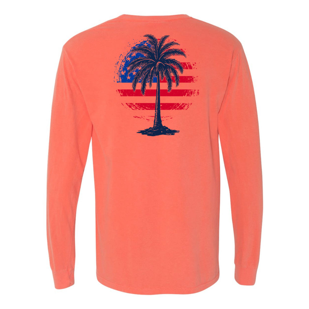 Coral long-sleeve shirt with a palm tree and American flag design on the back, against a white background.