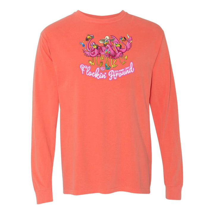 Coral long-sleeve shirt with flamingo design and text on a white background