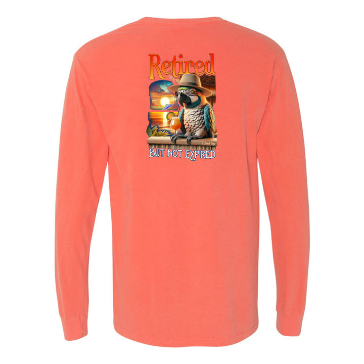 Coral long-sleeve shirt with a parrot graphic and text on the back, on a white background.