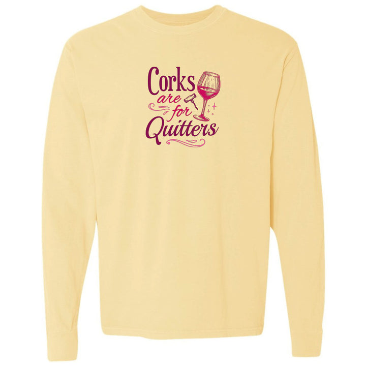 Yellow long-sleeve shirt with purple text and wine glass graphic on a white background
