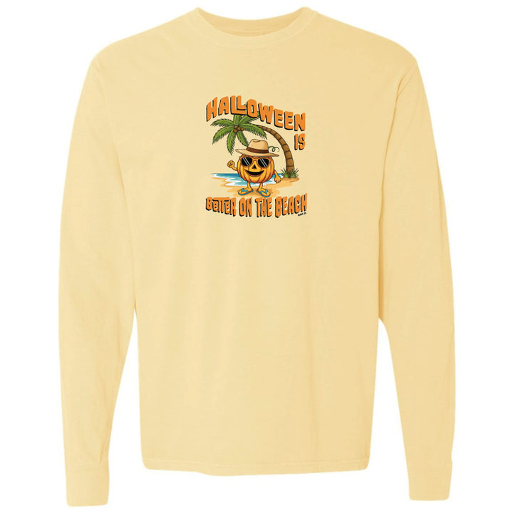 Yellow long-sleeve shirt with Halloween design featuring a palm tree and pumpkin on a white background