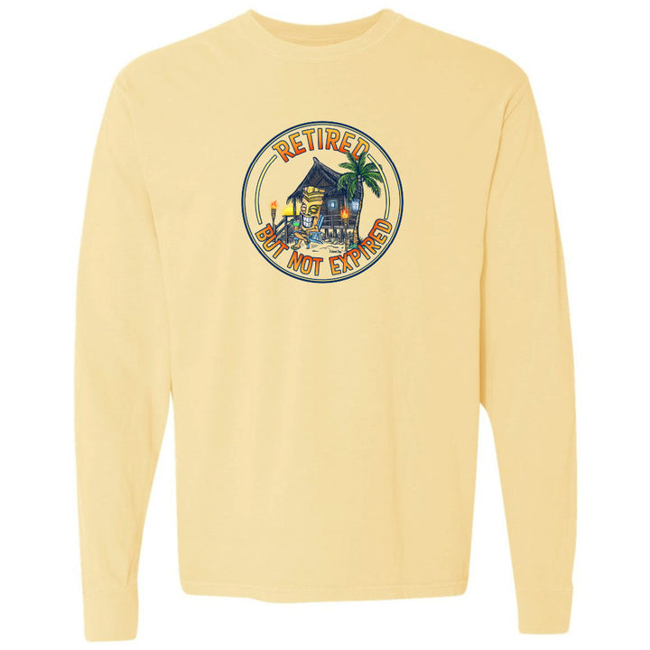 Yellow long-sleeve shirt with a tropical design and text on a white background
