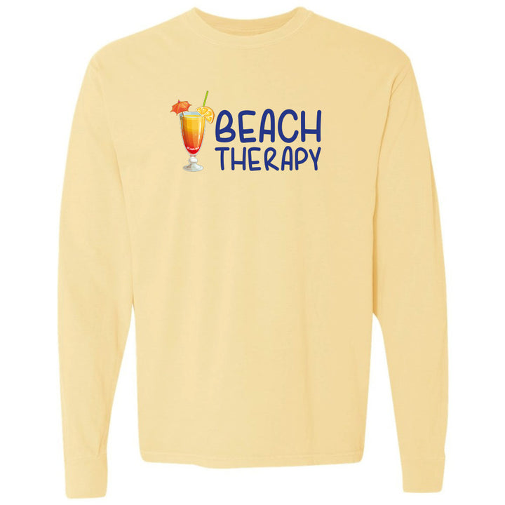 Yellow long-sleeve shirt with 'Beach Therapy' text and cocktail graphic on a white background