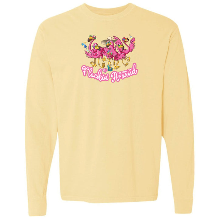Yellow long-sleeve shirt with flamingo graphic and text on a white background