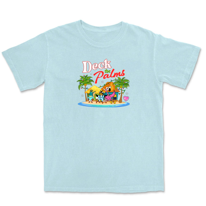 Light blue t-shirt with 'Deck the Palms' graphic design featuring cartoon characters and palm trees on a white background.