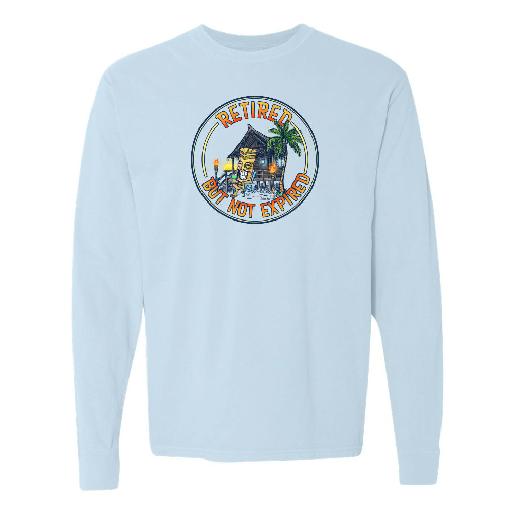 Light blue long-sleeve shirt with a tropical hut graphic and text on a white background