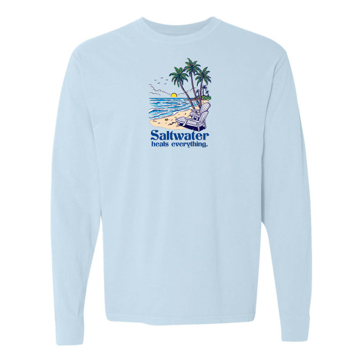 Light blue sweatshirt with a beach graphic and 'Saltwater heals everything' text on a white background