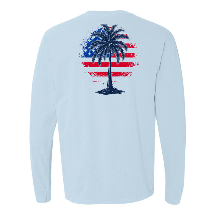 Light blue long-sleeve shirt with a palm tree design on a white background