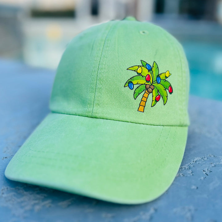 Deck The Palms Holiday Hat. Has a palm tree with Christmas lights.Lime Color