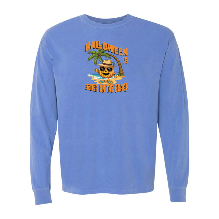 Blue long-sleeve shirt with Halloween design featuring a palm tree and pumpkin on a white background
