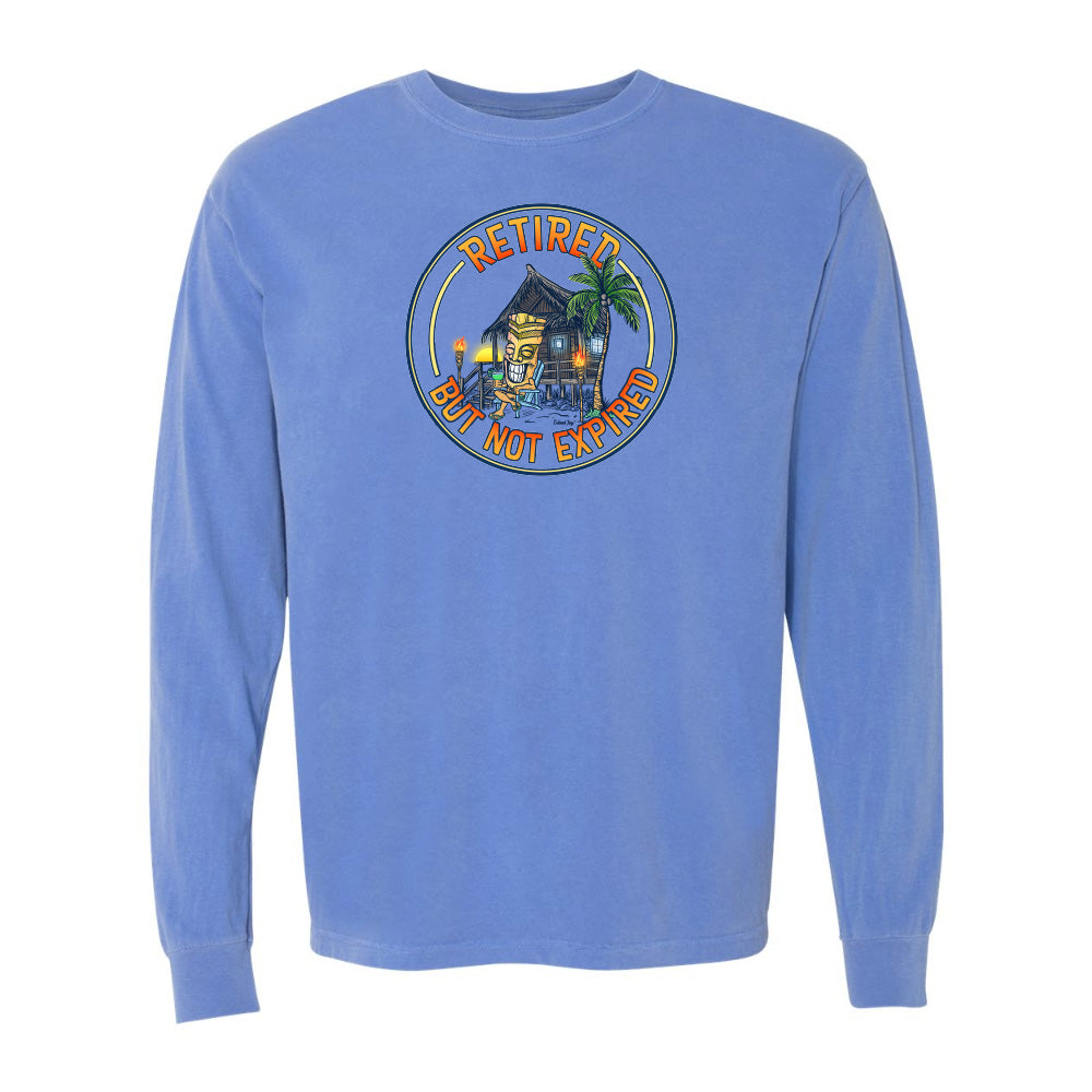Blue long-sleeve shirt with a tropical design and text on a white background