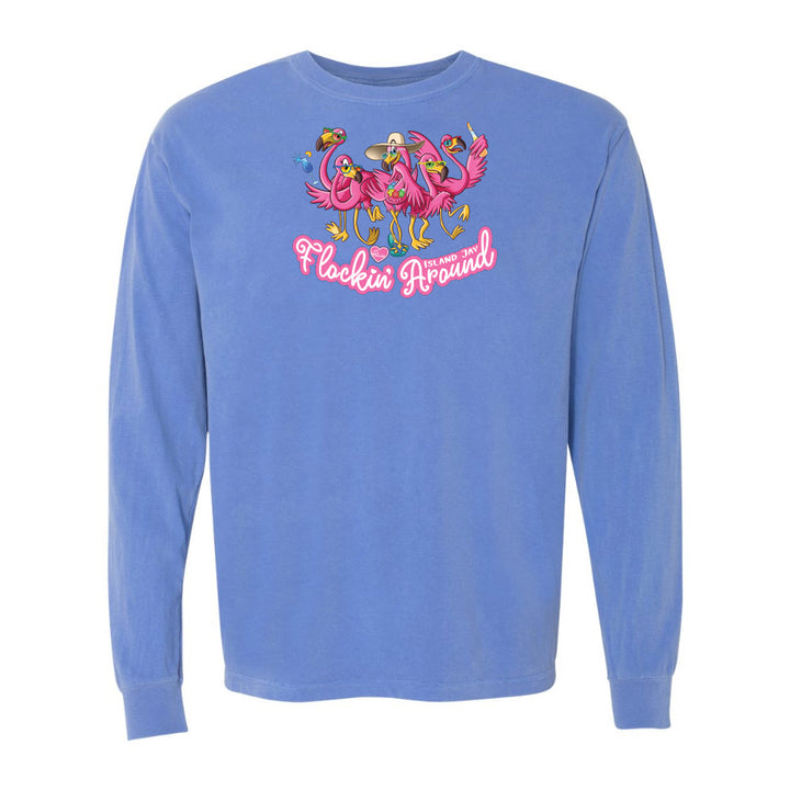 Blue long-sleeve shirt with pink flamingo design and text on a white background
