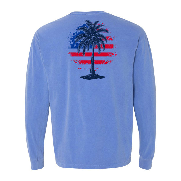 Blue long-sleeve shirt with a palm tree design on the back against a white background