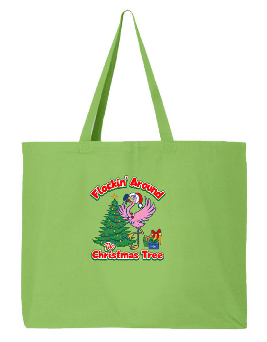 Green tote bag with Christmas-themed design featuring a flamingo and tree.
