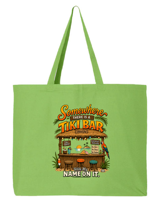 A light green canvas tote bag with two handles, featuring a colorful graphic print of a tropical 'Tiki Bar' with the text 'Somewhere there is a TIKI BAR' and 'With My NAME ON IT.'.