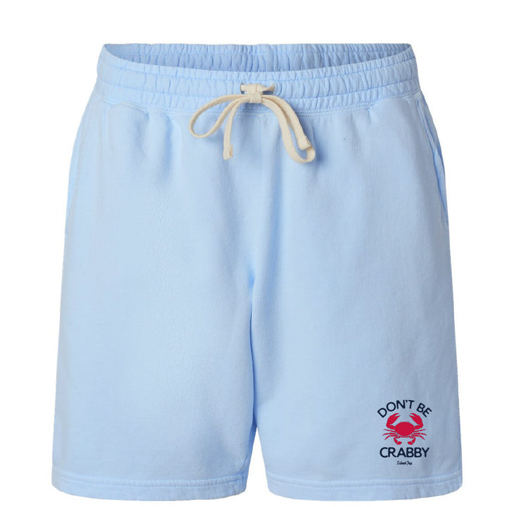 Light blue shorts with a 'Don't Be Crabby' graphic on a white background