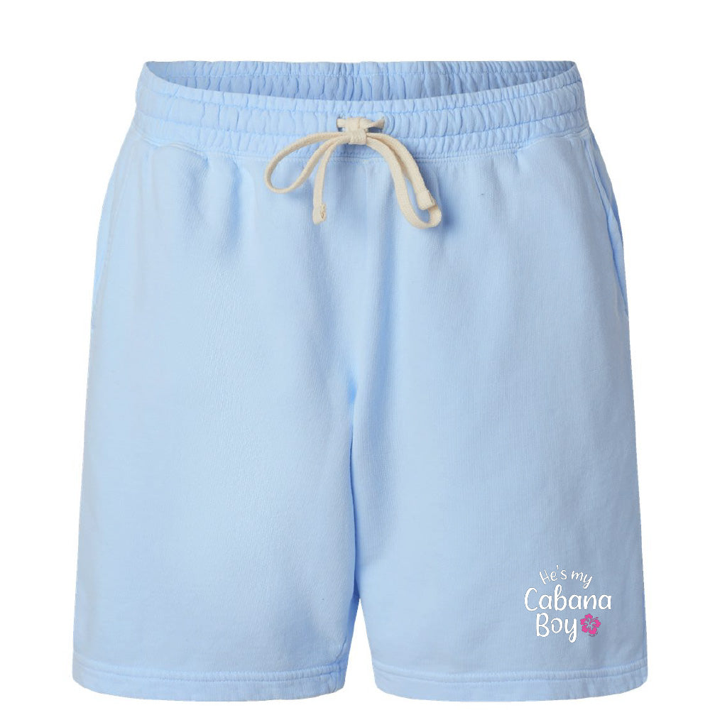 Light blue shorts with a drawstring on a white background, featuring 'He's my Cabana Boy' text.