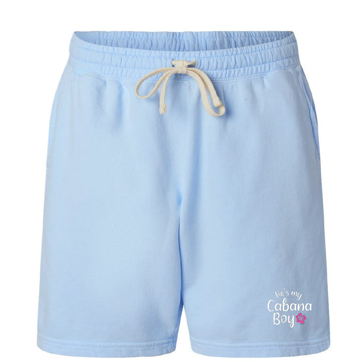 Light blue shorts with a drawstring on a white background, featuring 'He's my Cabana Boy' text.
