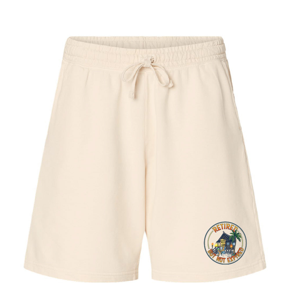 Beige shorts with a colorful graphic on a white background