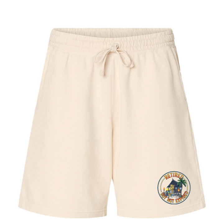 Beige shorts with a colorful graphic on a white background