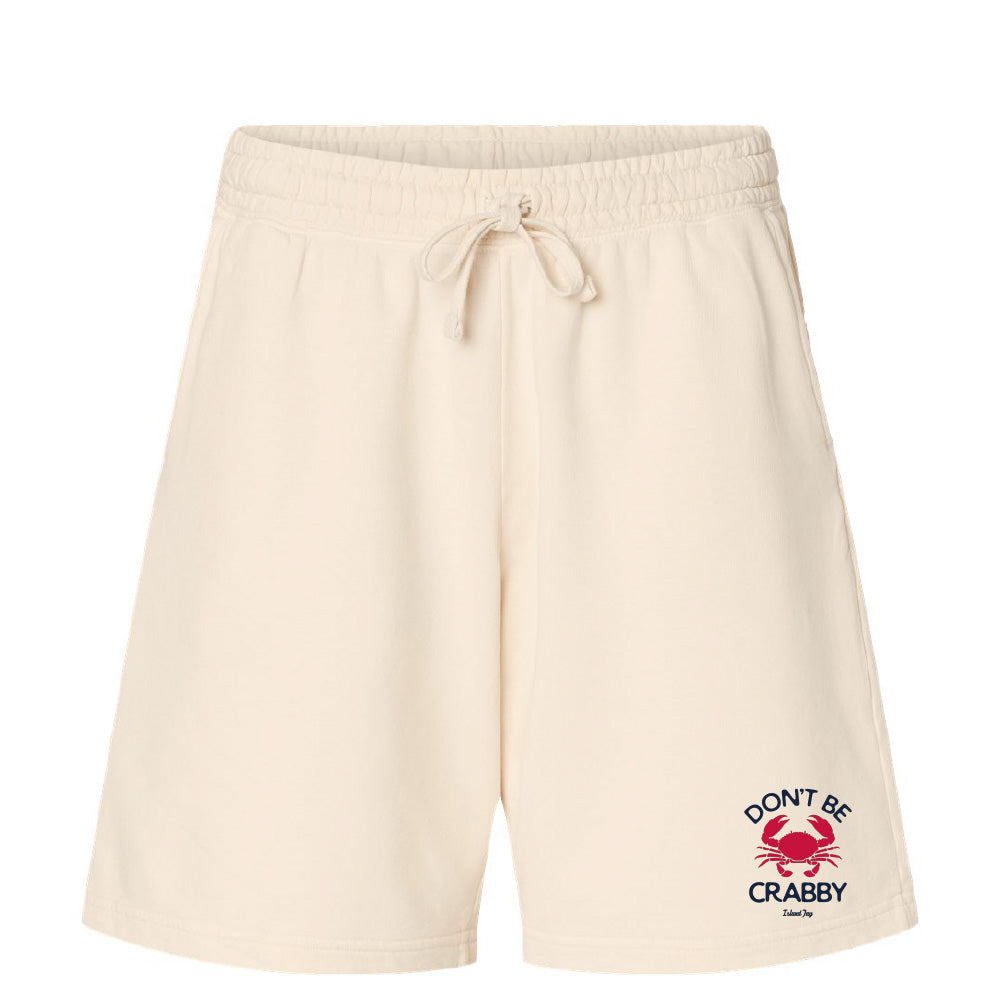 Beige shorts with a red and black graphic and text on a white background