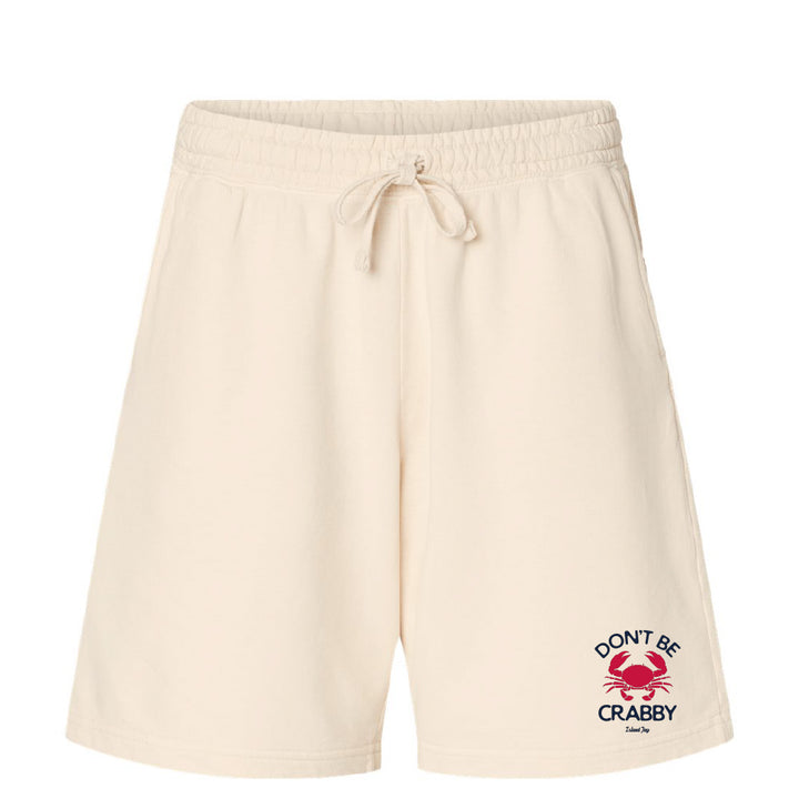 Beige shorts with a red and black graphic and text on a white background