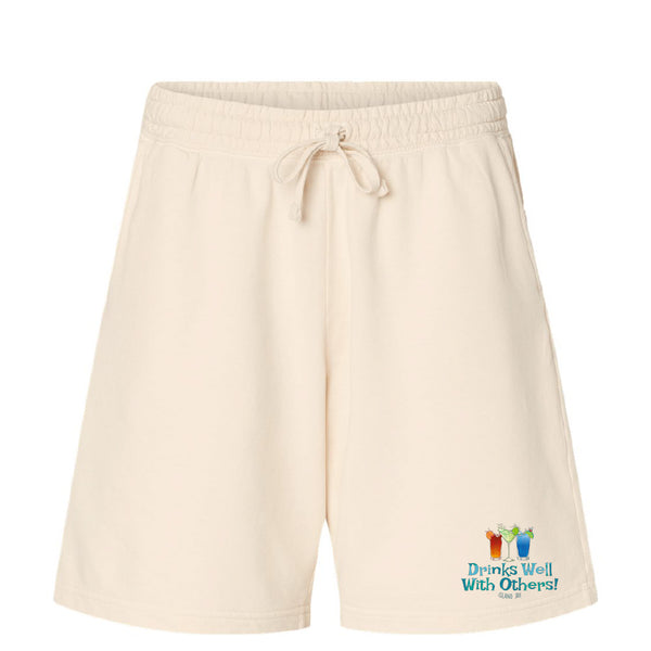 Beige shorts with a colorful graphic and text on a white background