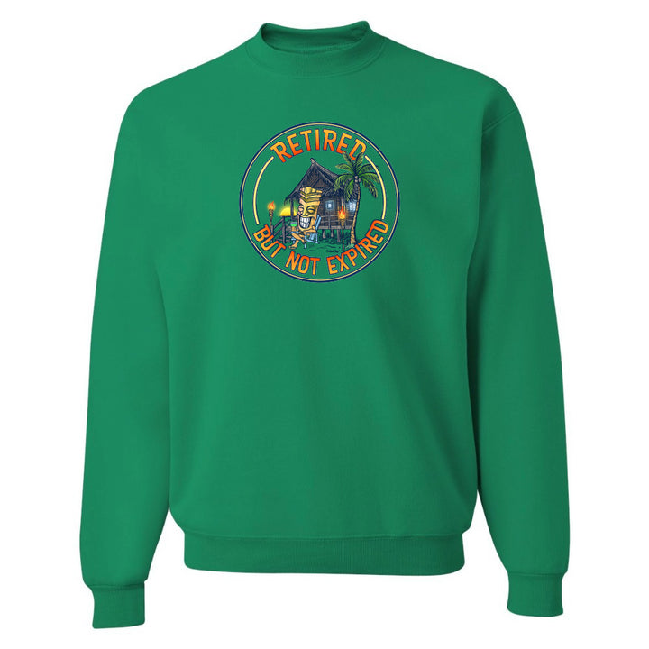 Green sweatshirt with a retirement-themed graphic on a white background