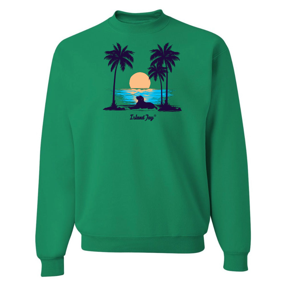 Green sweatshirt with a tropical design featuring palm trees and a sunset on a white background