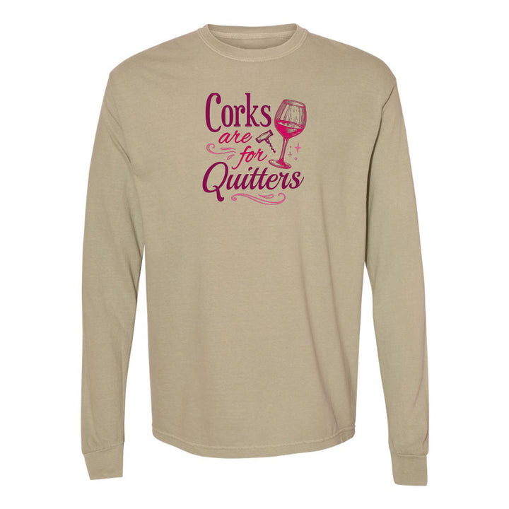 Beige long-sleeve shirt with pink text and wine glass graphic on a white background
