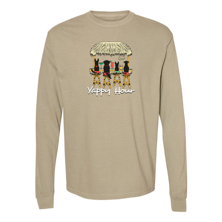 Beige long-sleeve shirt with a graphic of dogs under a tiki hut and 'Yappy Hour' text on a white background.