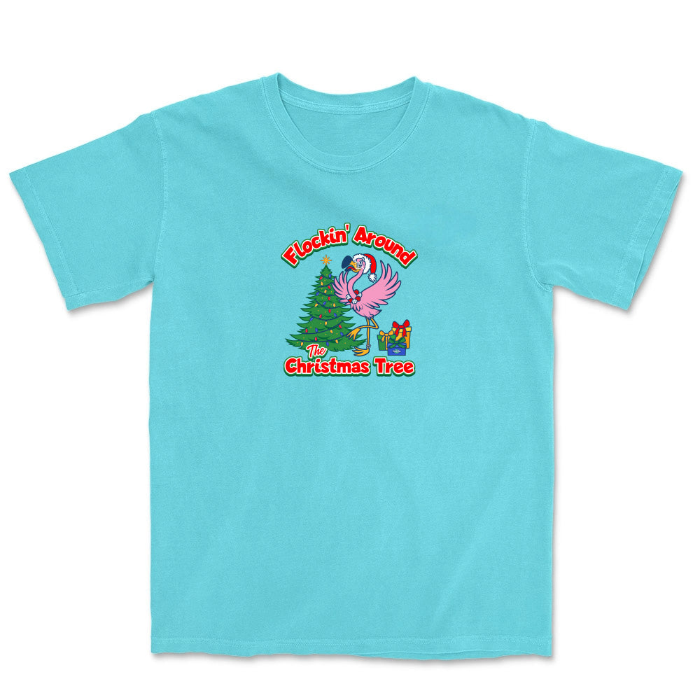Light blue t-shirt with a festive design featuring a flamingo and Christmas tree on a white background