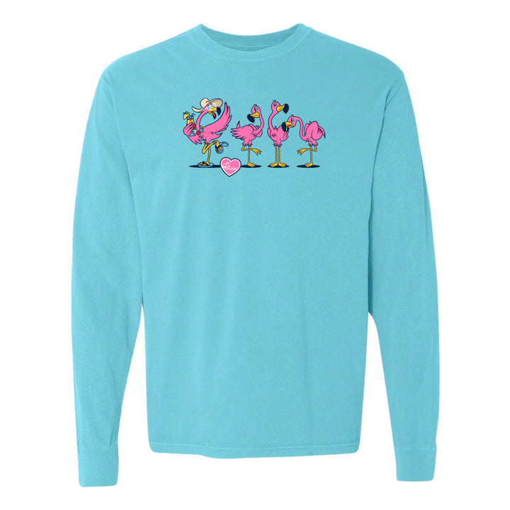 Light blue long-sleeve shirt with cartoon flamingos and a heart on a white background