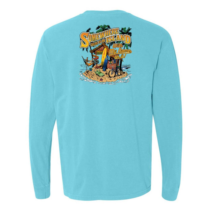 Light blue long-sleeve shirt with a colorful graphic on the back featuring text and beach elements.