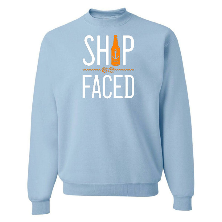 Light blue sweatshirt with 'SHIP FACED' text and bottle graphic on a white background
